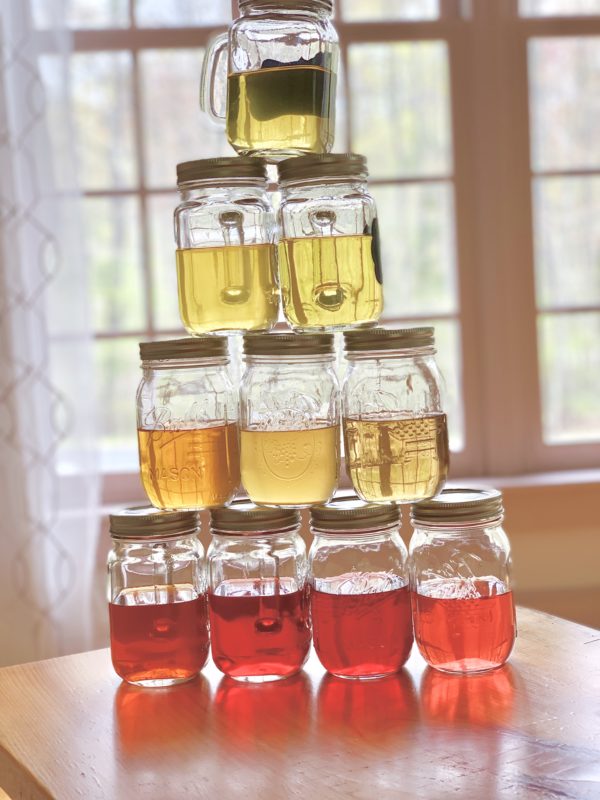 A tower of iced tea jars.